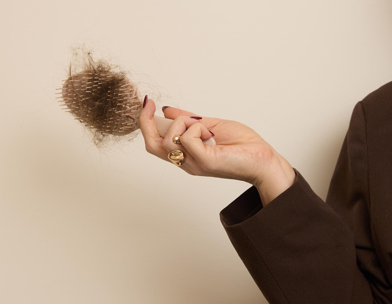 Image of an image of a hair brush with hair