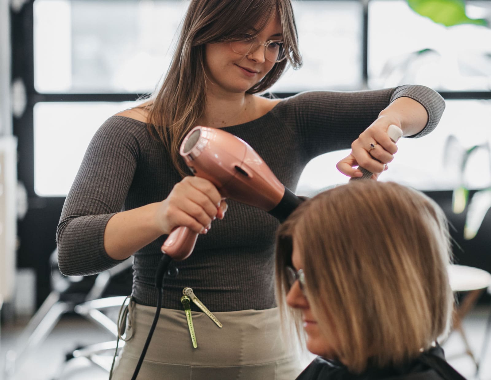Image of an image of a stylist doing hair