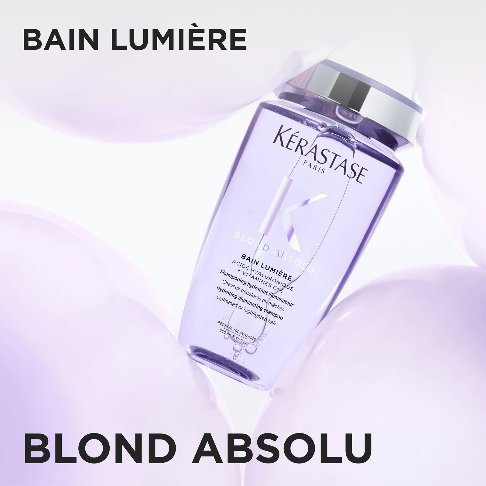 Image of Kérastase Bain Lumière Blond Absolu shampoo bottle on a light purple background