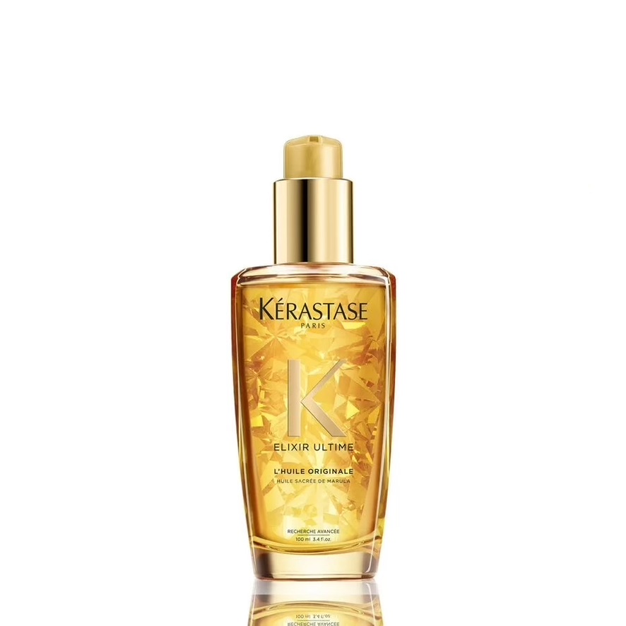 A bottle of kérastase elixir ultime hair oil displayed against a neutral background.