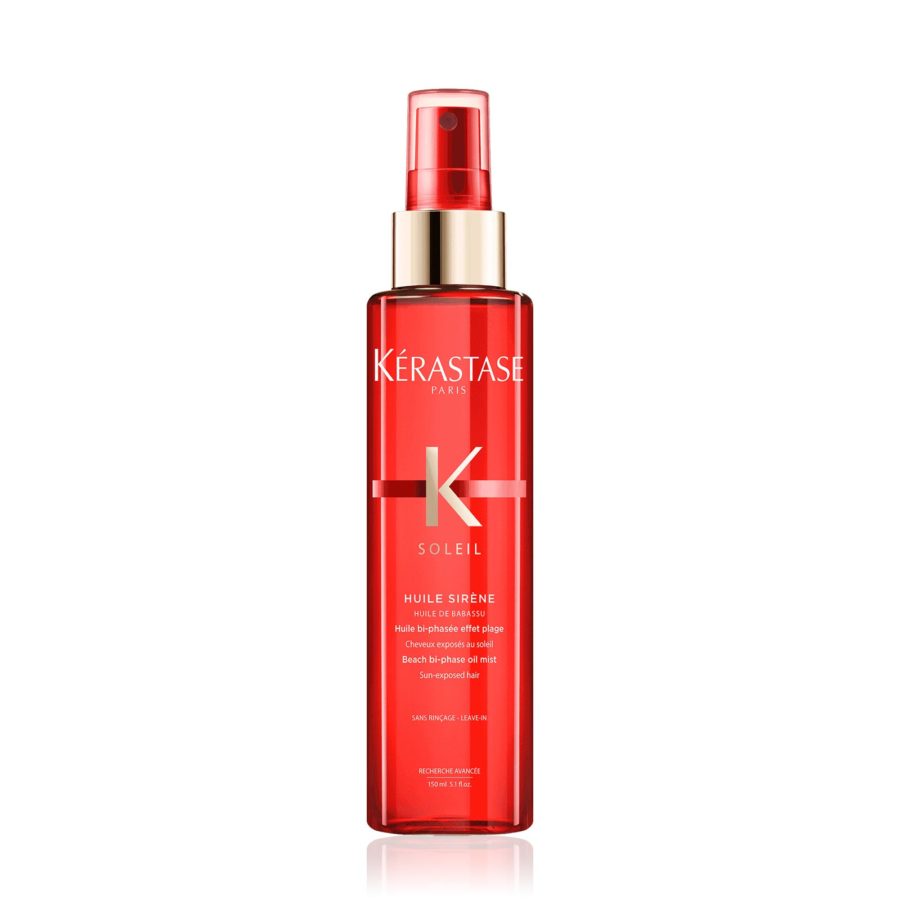 A bottle of kérastase paris soleil huile sirène hair oil spray against a white background.