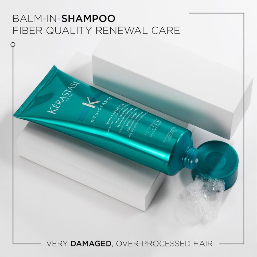 A tube of kerastase balm-in-shampoo for very damaged, over-processed hair is displayed against a clean white background, with the product cap open and a dollop of the shampoo visible.