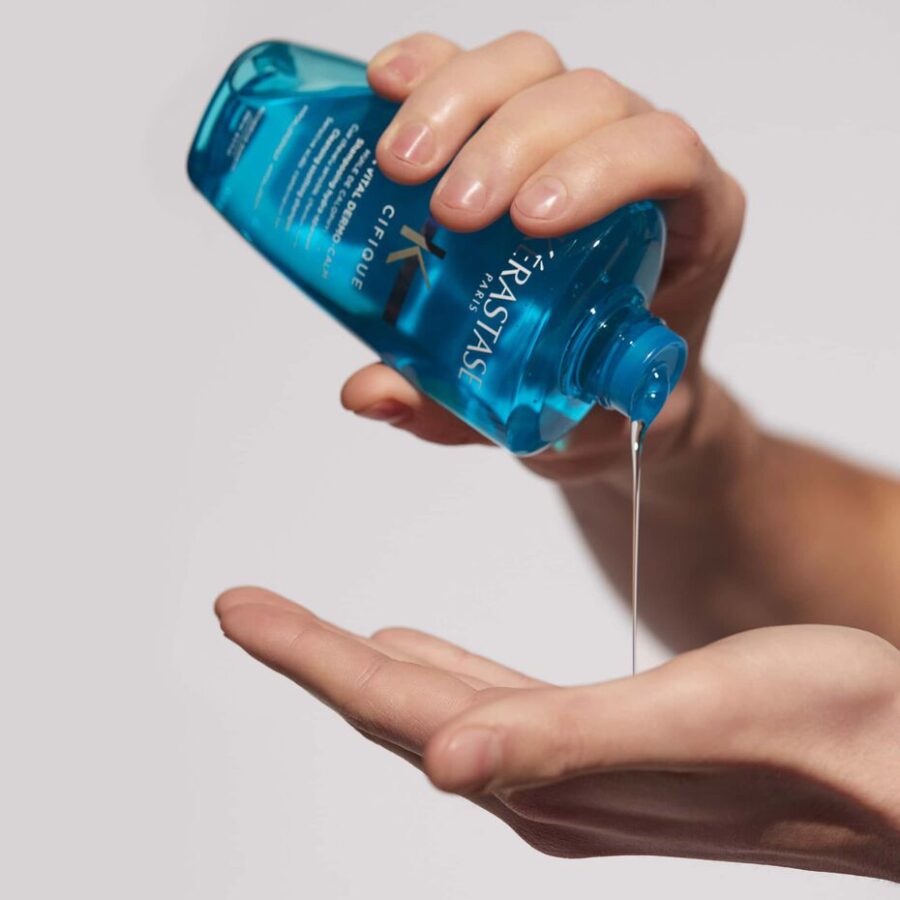 an image of the dermo calm shampoo being poured into a hand.