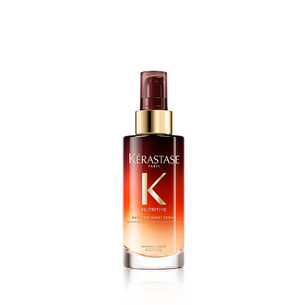 A bottle of kérastase nutritive 8h magic night serum against a white background.
