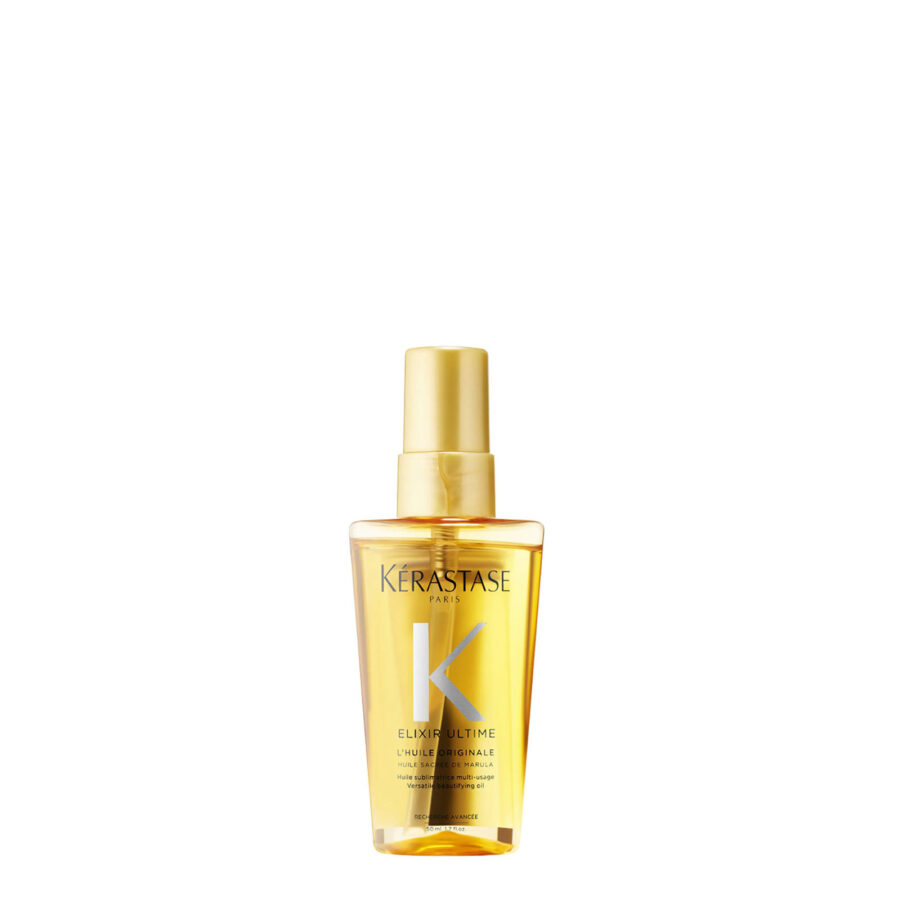 Bottle of travel size kérastase elixir ultime hair oil on a white background.
