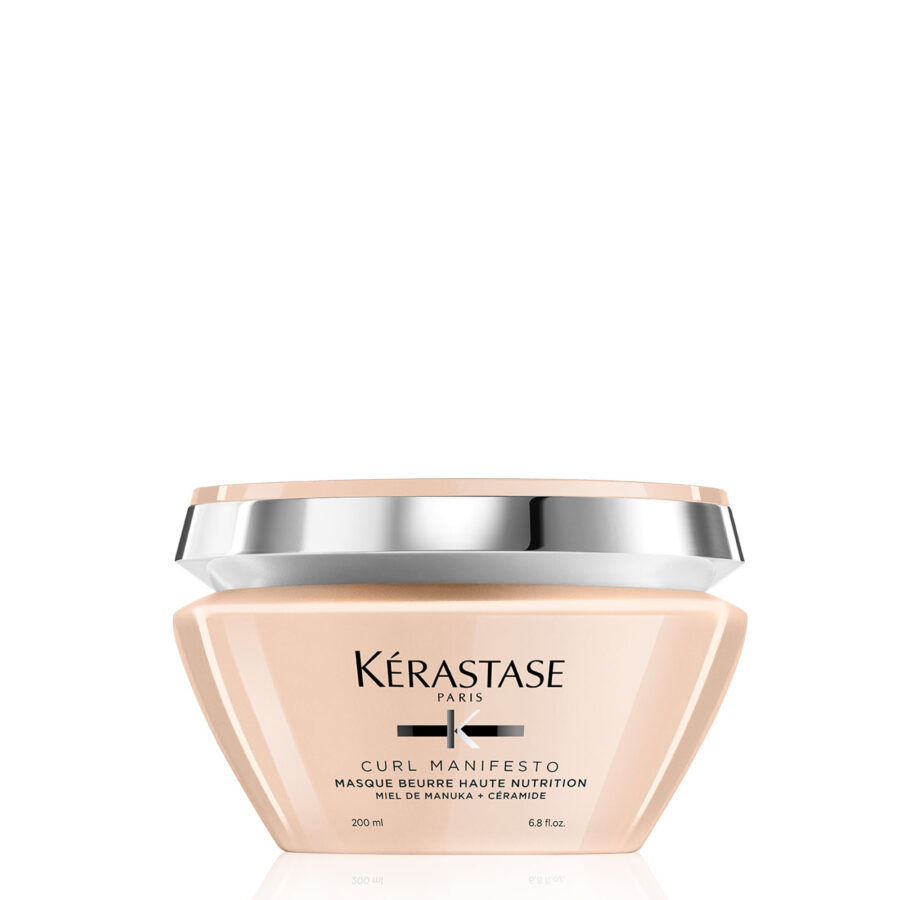A container of kérastase paris hair mask product for curls.