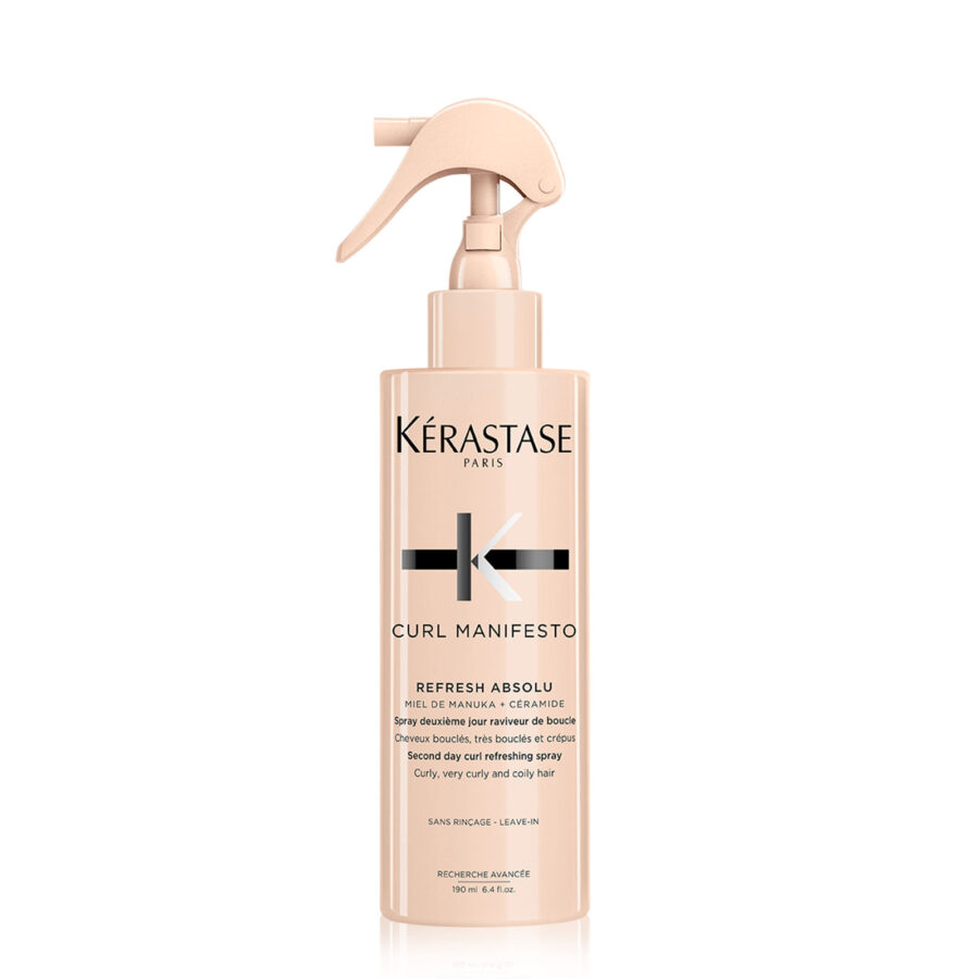 A bottle of kérastase curl manifesto hair refreshing product with a spray nozzle.