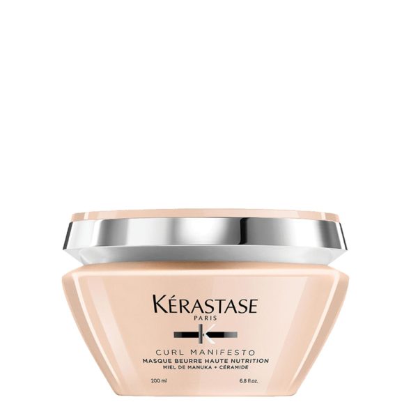 A container of kérastase paris hair mask product for curls.