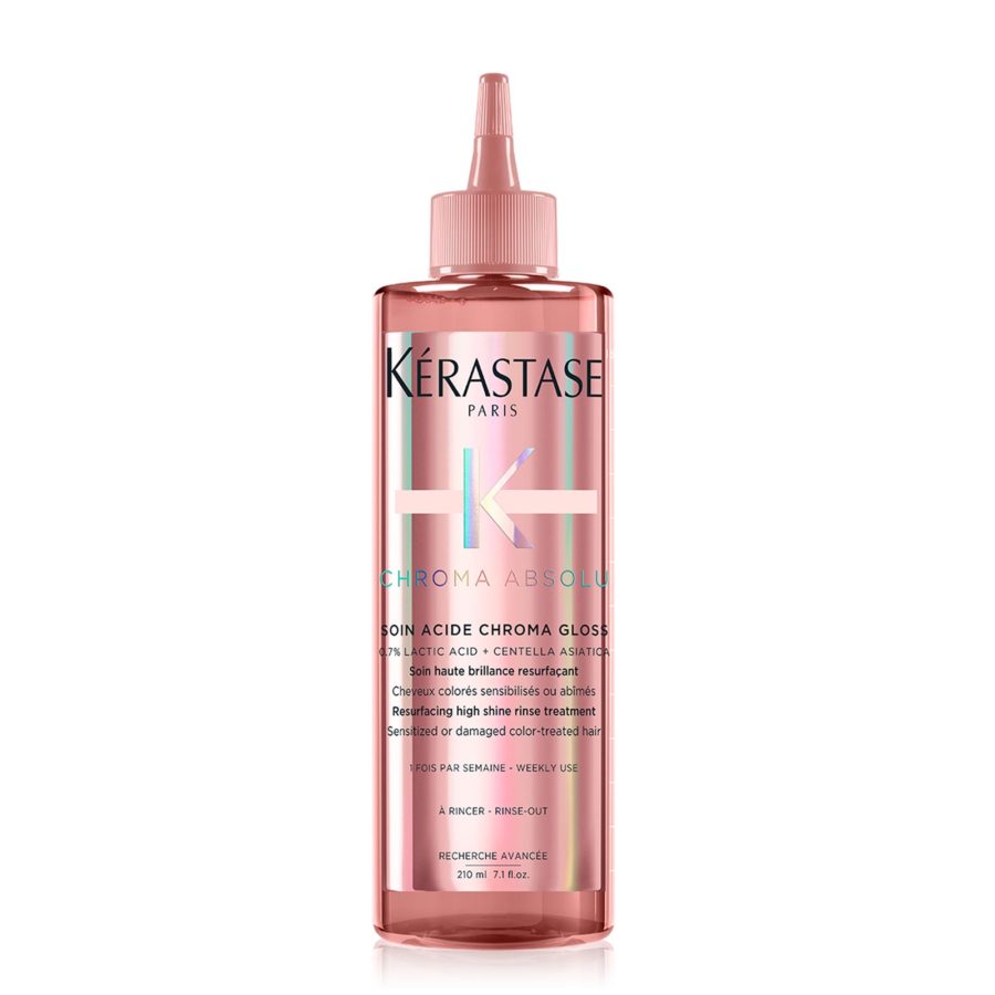 Bottle of kérastase chroma absolu soin acide chroma gloss hair treatment product.
