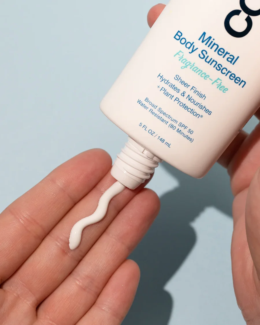 an image of the lotion mineral body sunscreen being put into a hand.