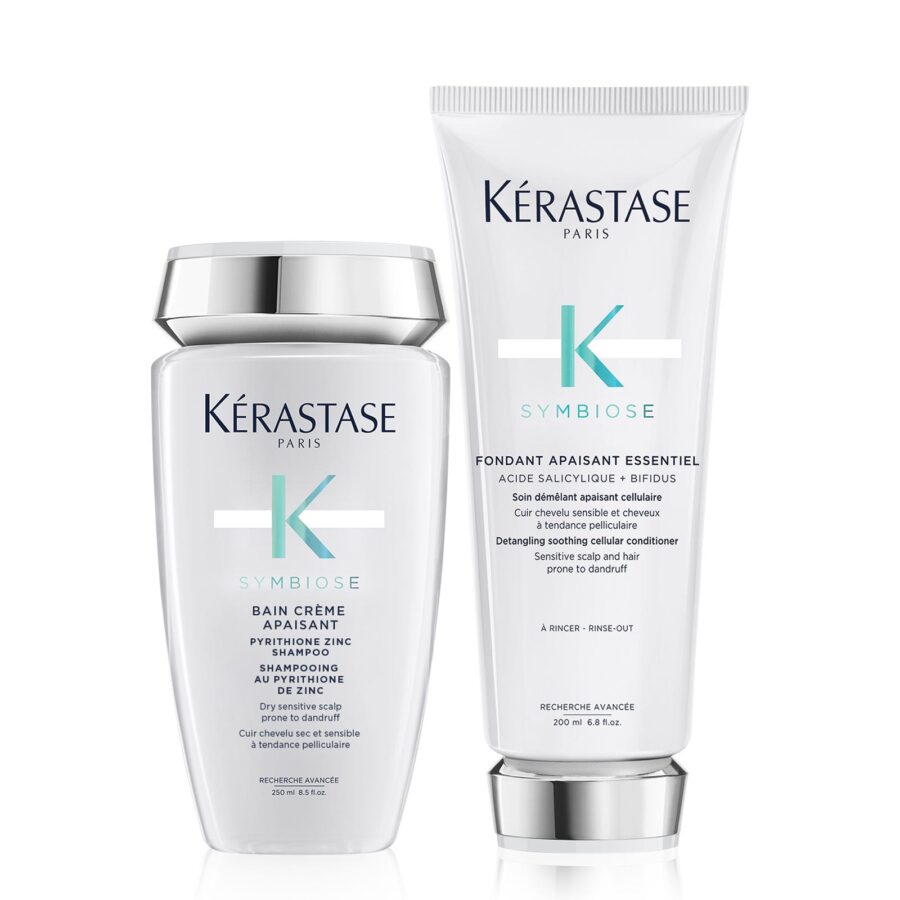 Two symbiose dandruff prone kérastase hair care products: a shampoo bottle and a conditioner tube.
