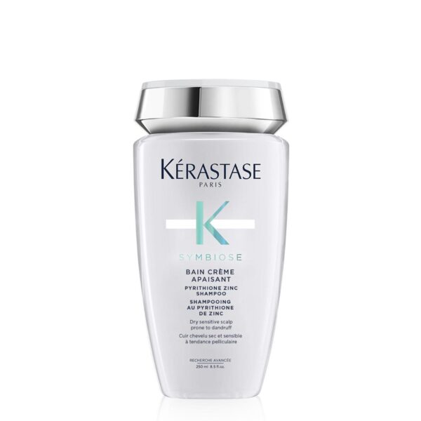 A bottle of kérastase paris bain crème shampoo with zinc pyrithione.