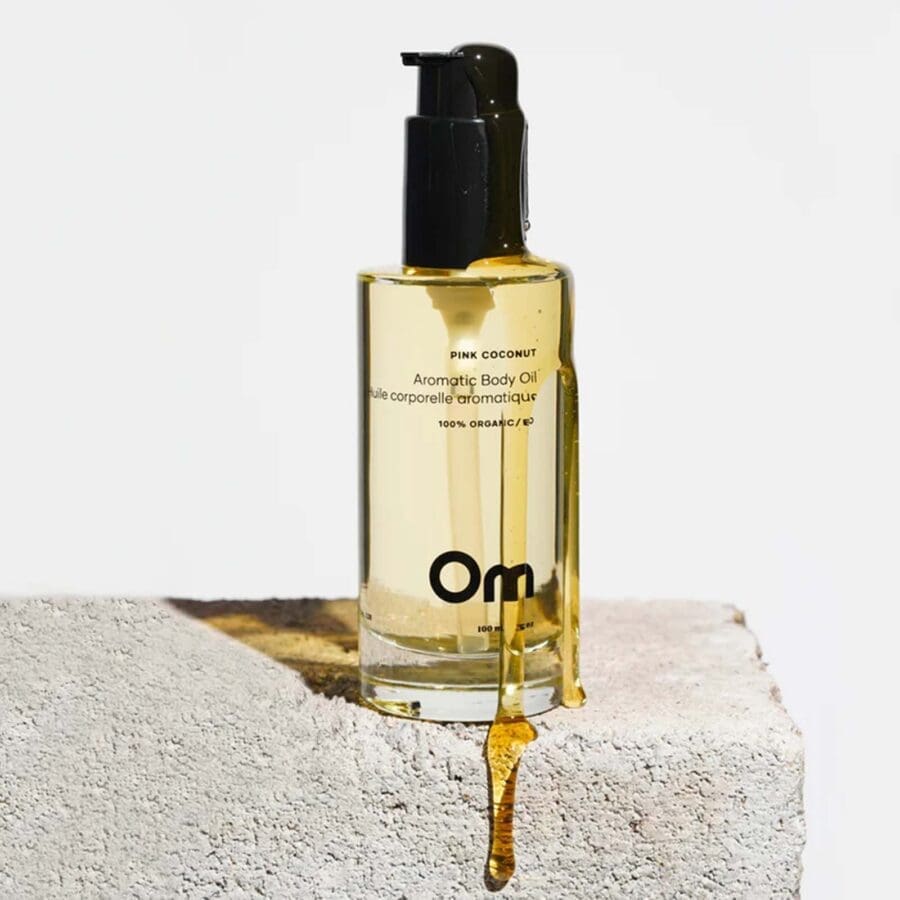 a lightweight hydrating oil for all skin types with scents of coconut and rose