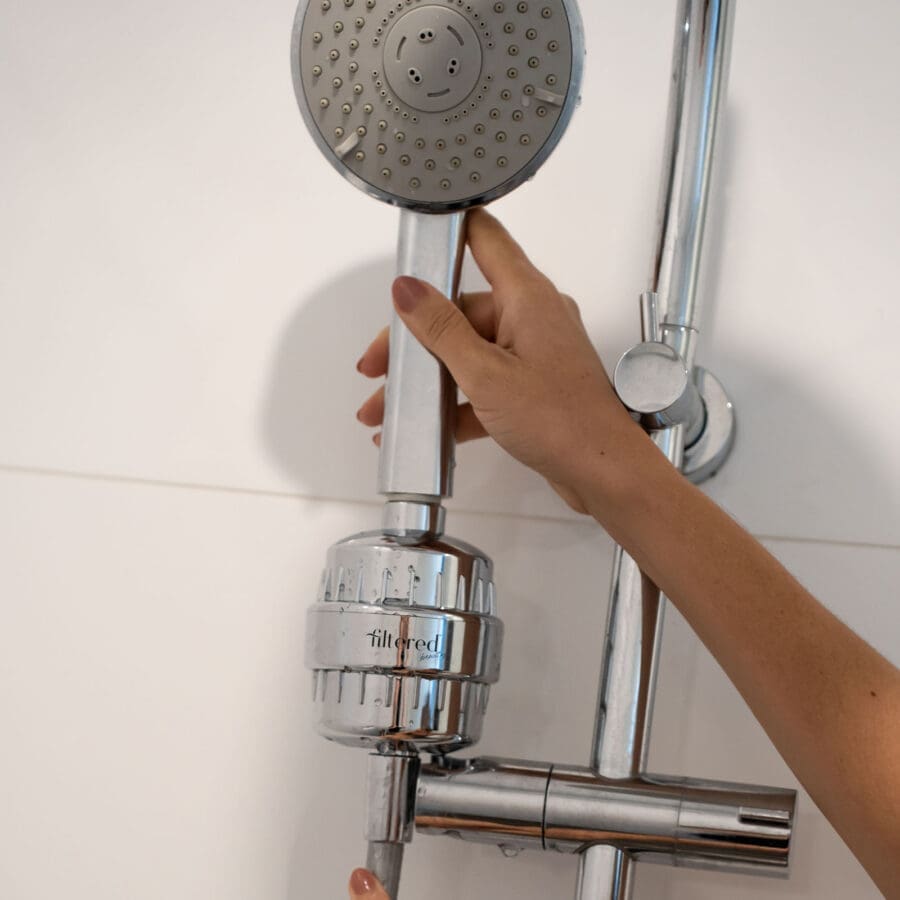 Silver Shower Head attachement on a shower head - used to filter out hard metals and chemicals