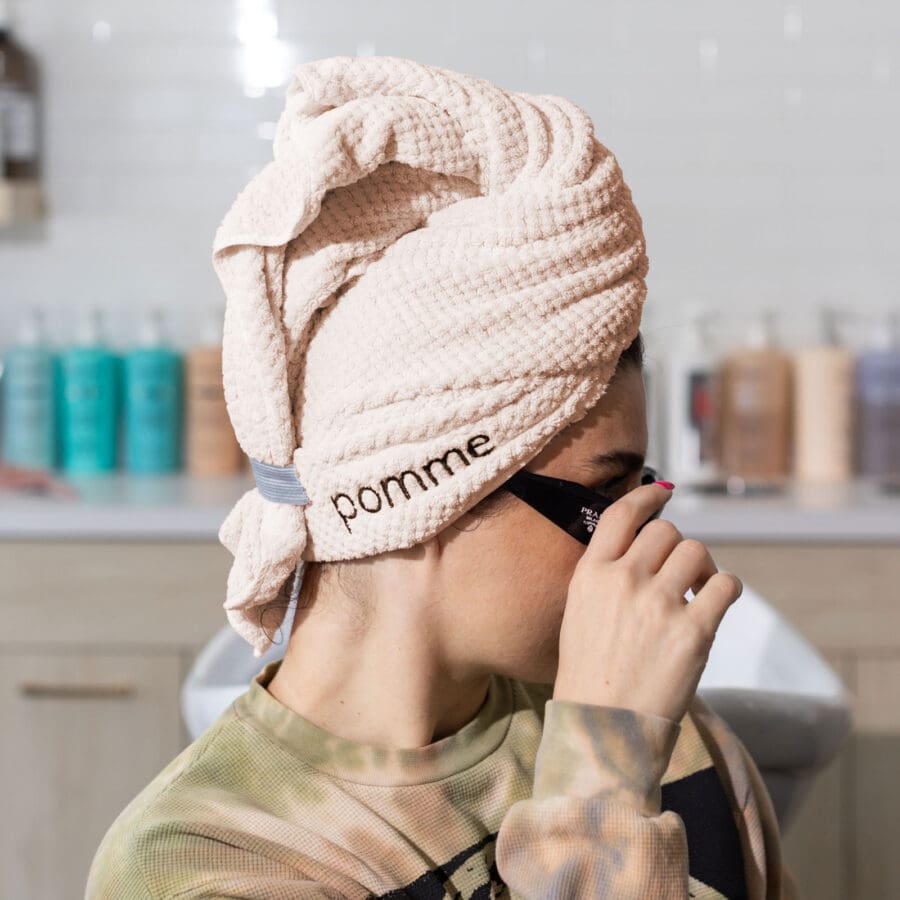 an image of rebecca wearing a hair towel