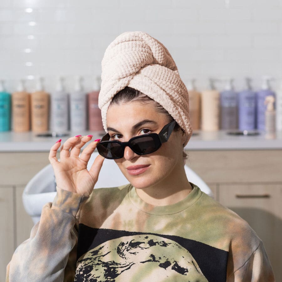 an image of rebecca wearing a hair towel
